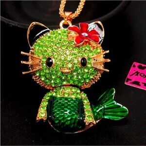 NWT. Betsey Johnson. Gold Green Enameled hello kitty Mermaid Necklace.